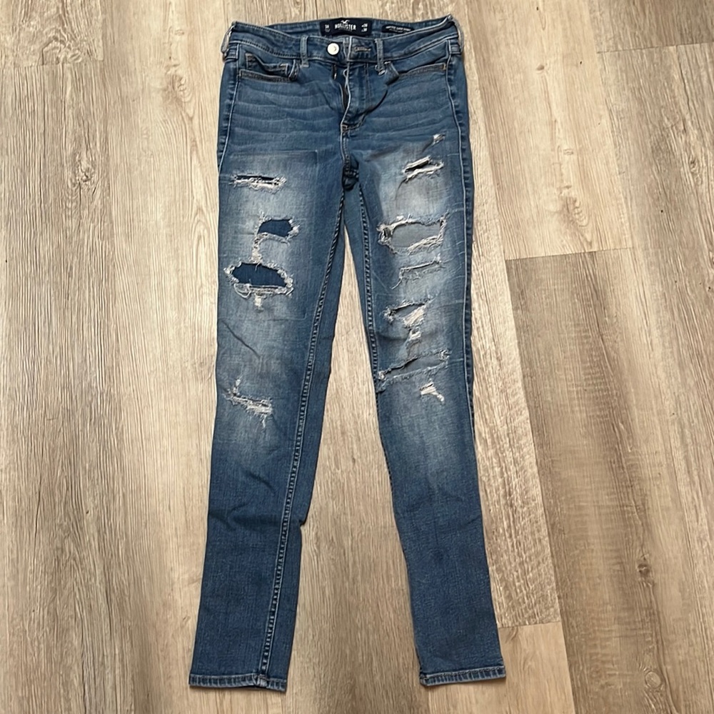 Woman’s ripped blue jeans